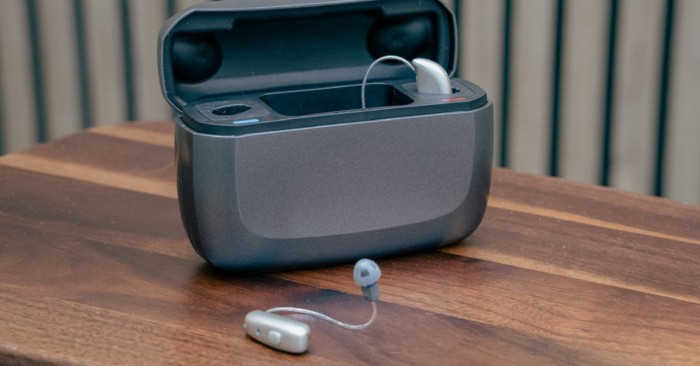 What to expect when wearing hearing aids - a pair of Resound Vivia hearing aids in charger