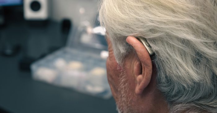 Why new hearing aids sound weird? A man wearing an open fit receiver in the canal hearing aid