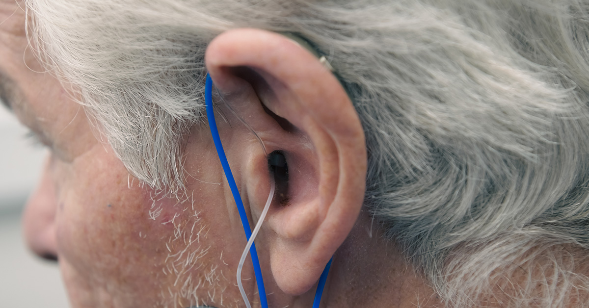 Man having real ear measurements conducted at Alto Hearing