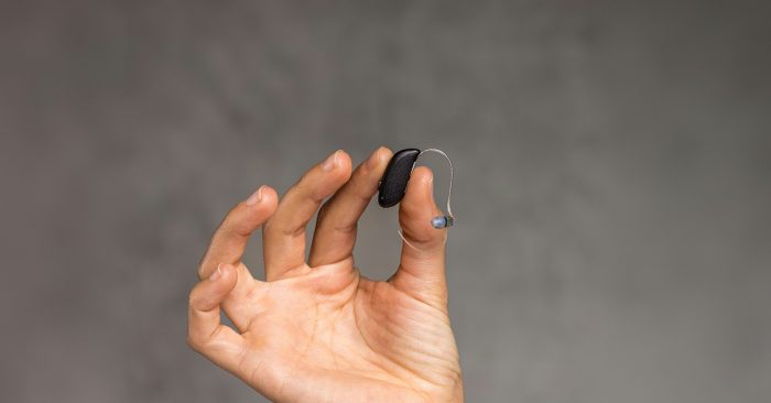 Receiver in the canal hearing aid held in hand.