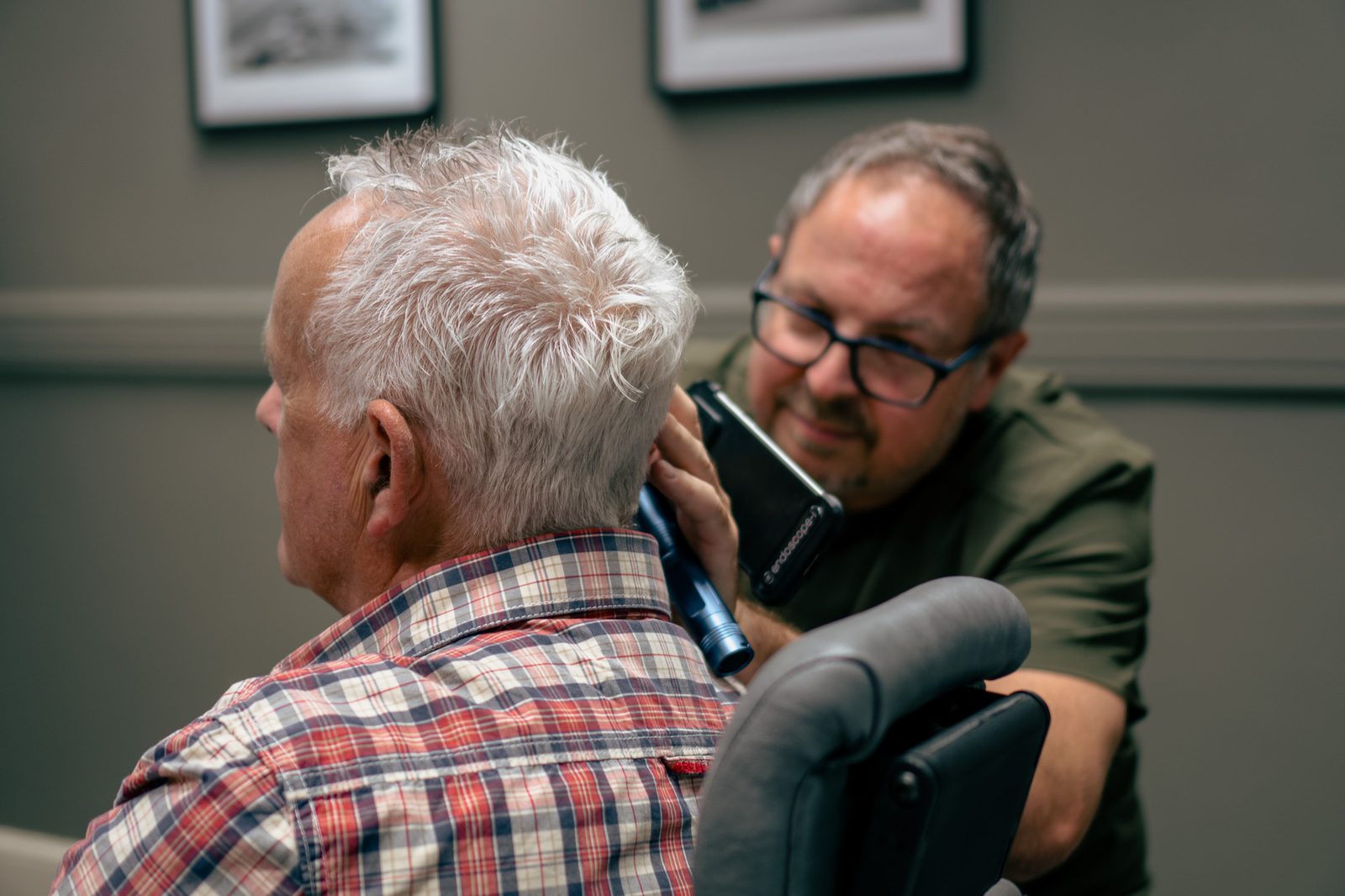 Clinician carrying out an ear check before ear wax removal at Alto Hearing