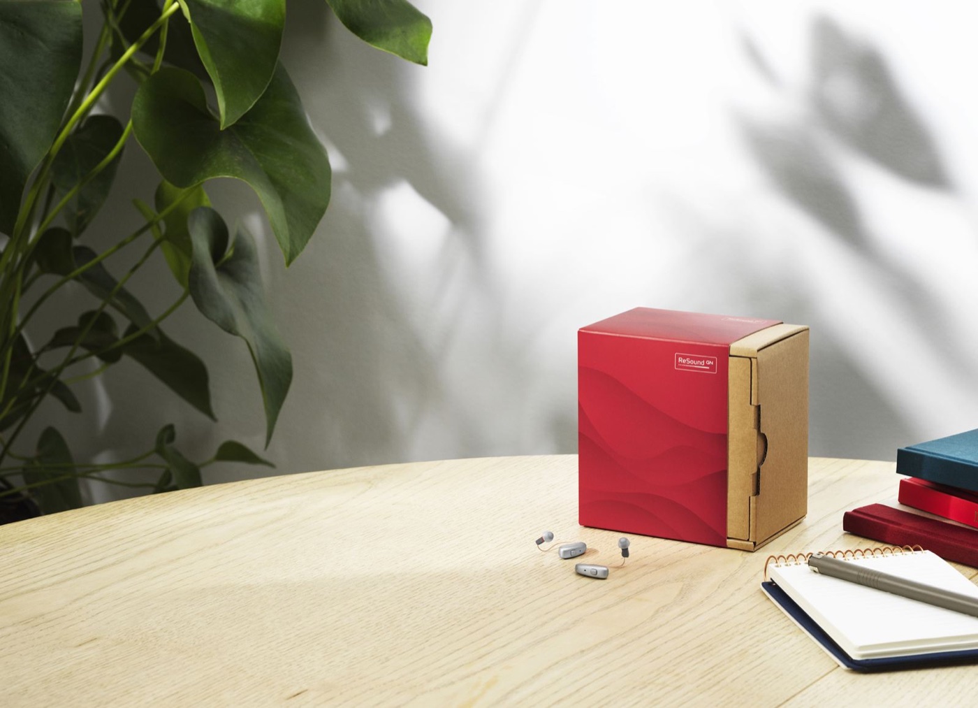 ReSound private rechargeable hearing aids with product packaging