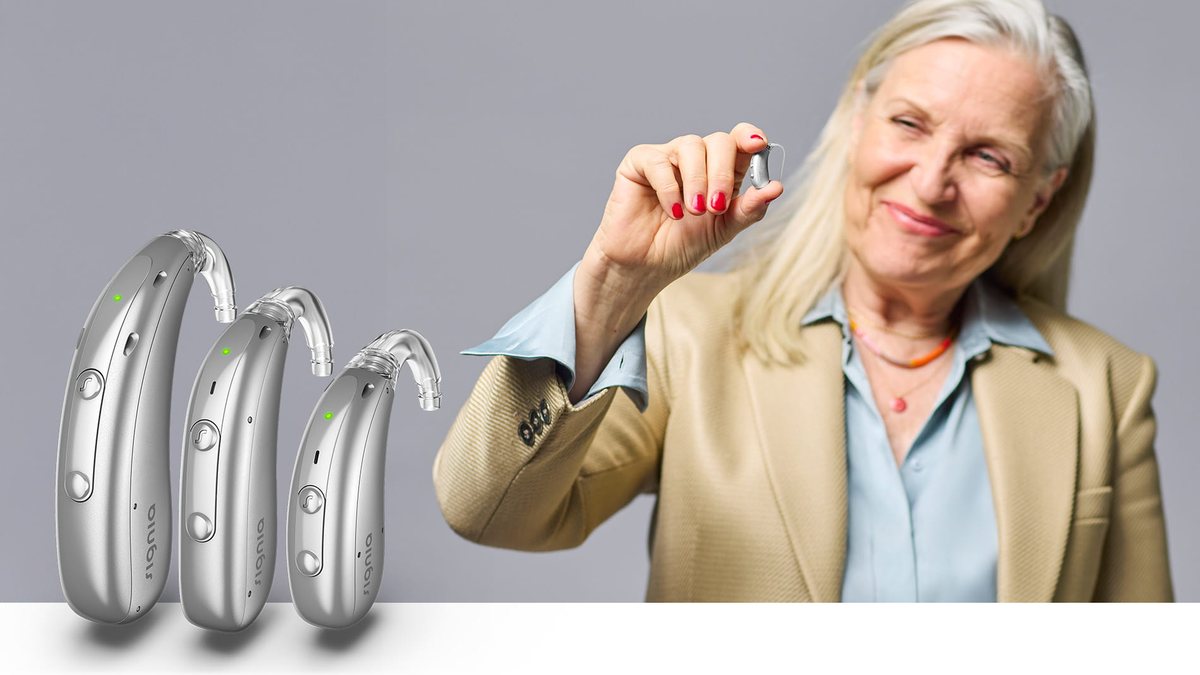 Signia Motion Charge&Go IX hearing aid held between fingers