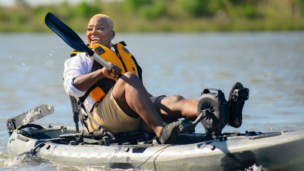 Man kayaking illustrating Starkey waterproof hearing aids