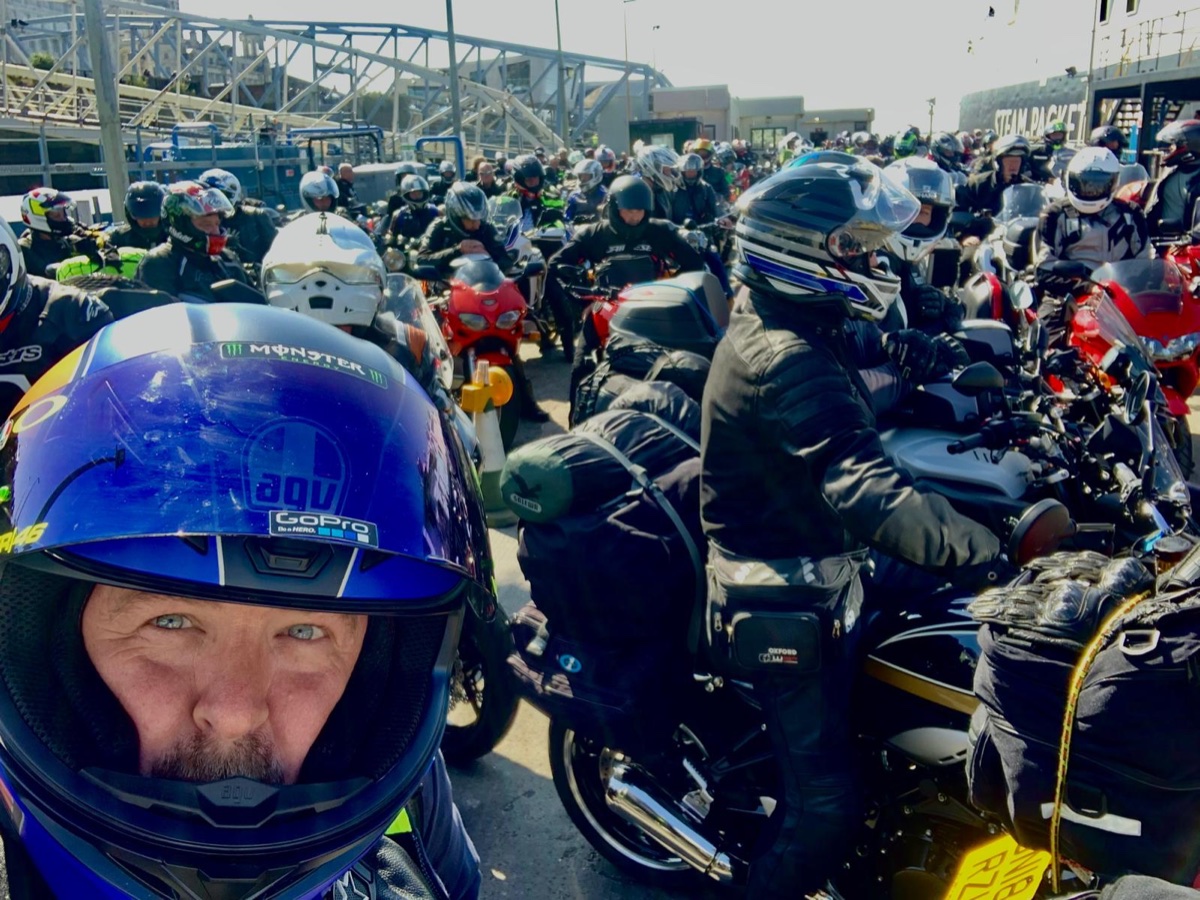 Carl Morley in a helmet during a busy motorcycle group ride