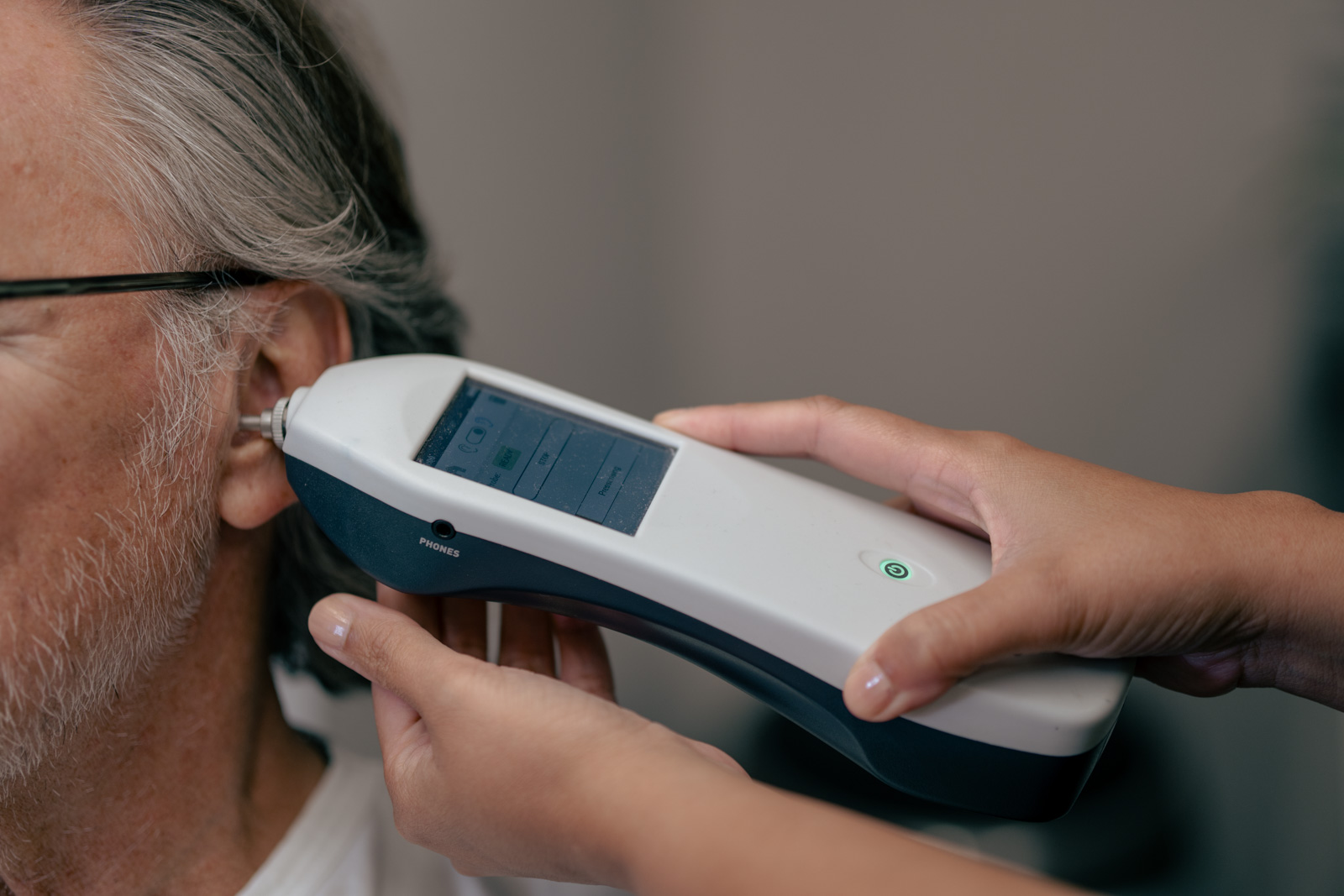 Middle-ear function being checked with a handheld tympanometer at Alto Hearing